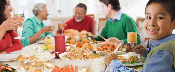 boy at dinner table with family